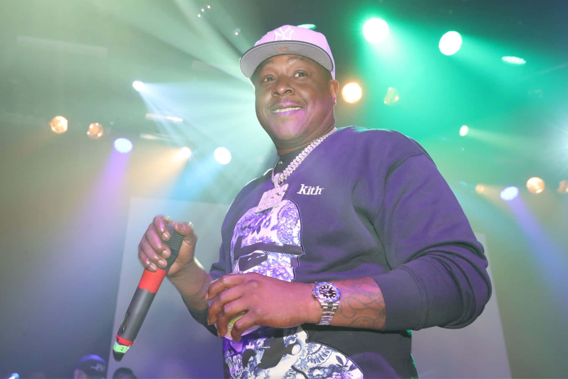 Jadakiss performing live with microphone, showcasing raw New York hip-hop energy